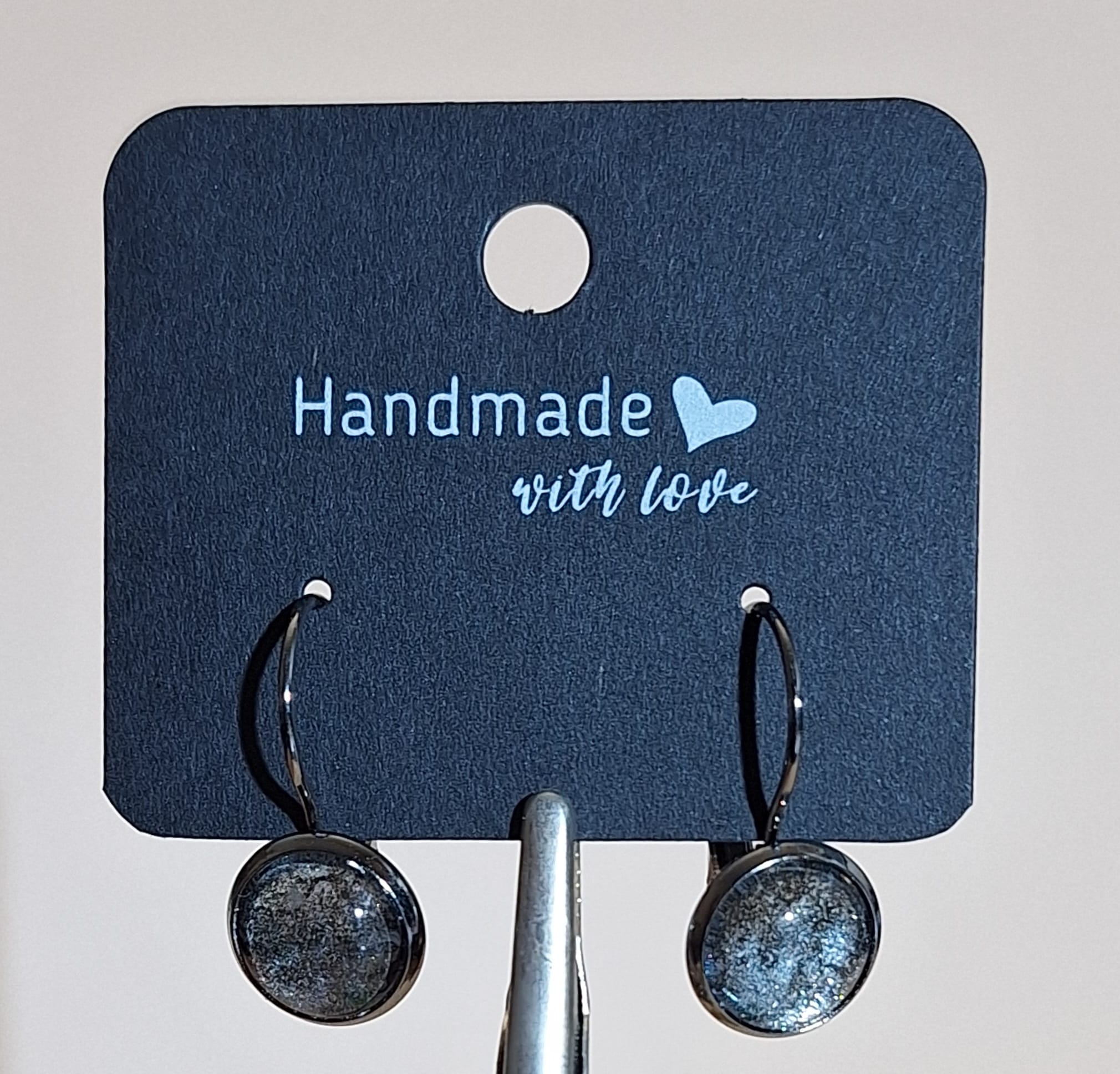 Ohrhänger schwarz - geschlossen - schwarz-silber-melliert Ohrhänger schwarz - geschlossen - schwarz-silber-meliert